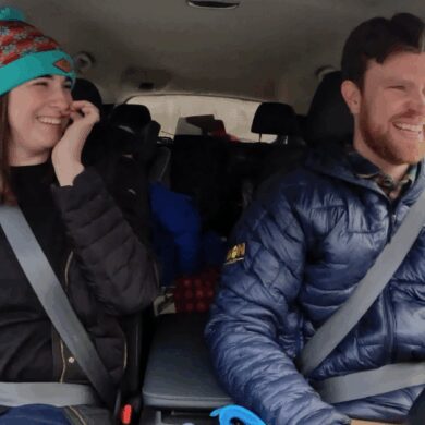 A family in a car, packed up to head to the Ski Resort.