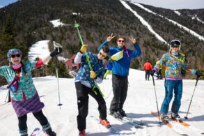 Friends taking a break to smile on a sunny day of skiing