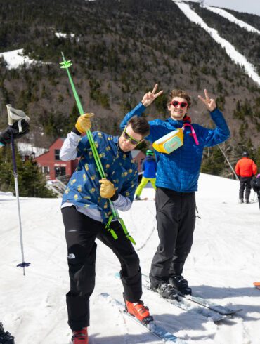 Friends taking a break to smile on a sunny day of skiing