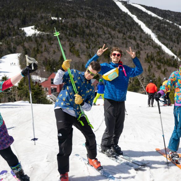 Friends taking a break to smile on a sunny day of skiing