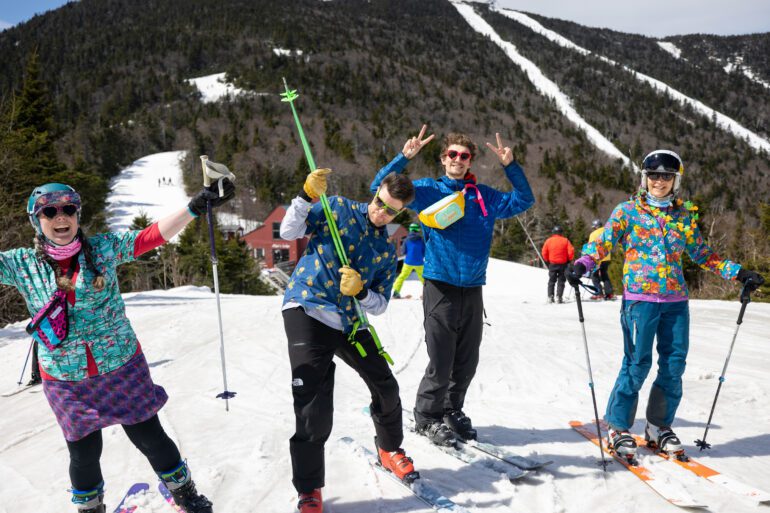 Friends taking a break to smile on a sunny day of skiing