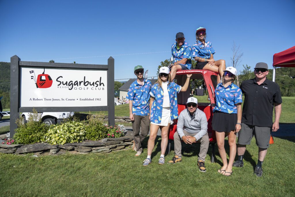 A group of golfers in matching shirts at the High Fives Golf Tournament at Sugarbush Resort