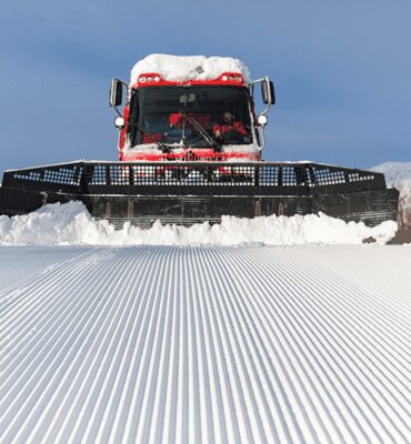 Snowcat grooming snow