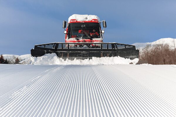 Snowcat grooming snow