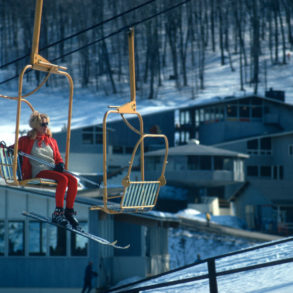 old chairlift shot with woman