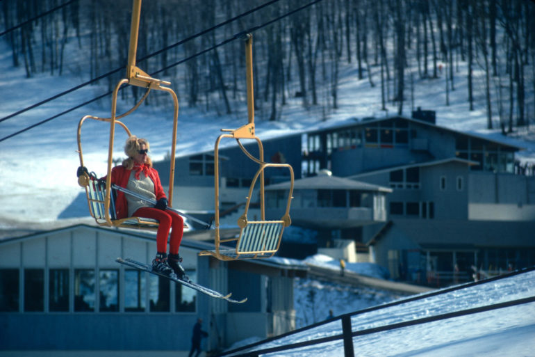 old chairlift shot with woman